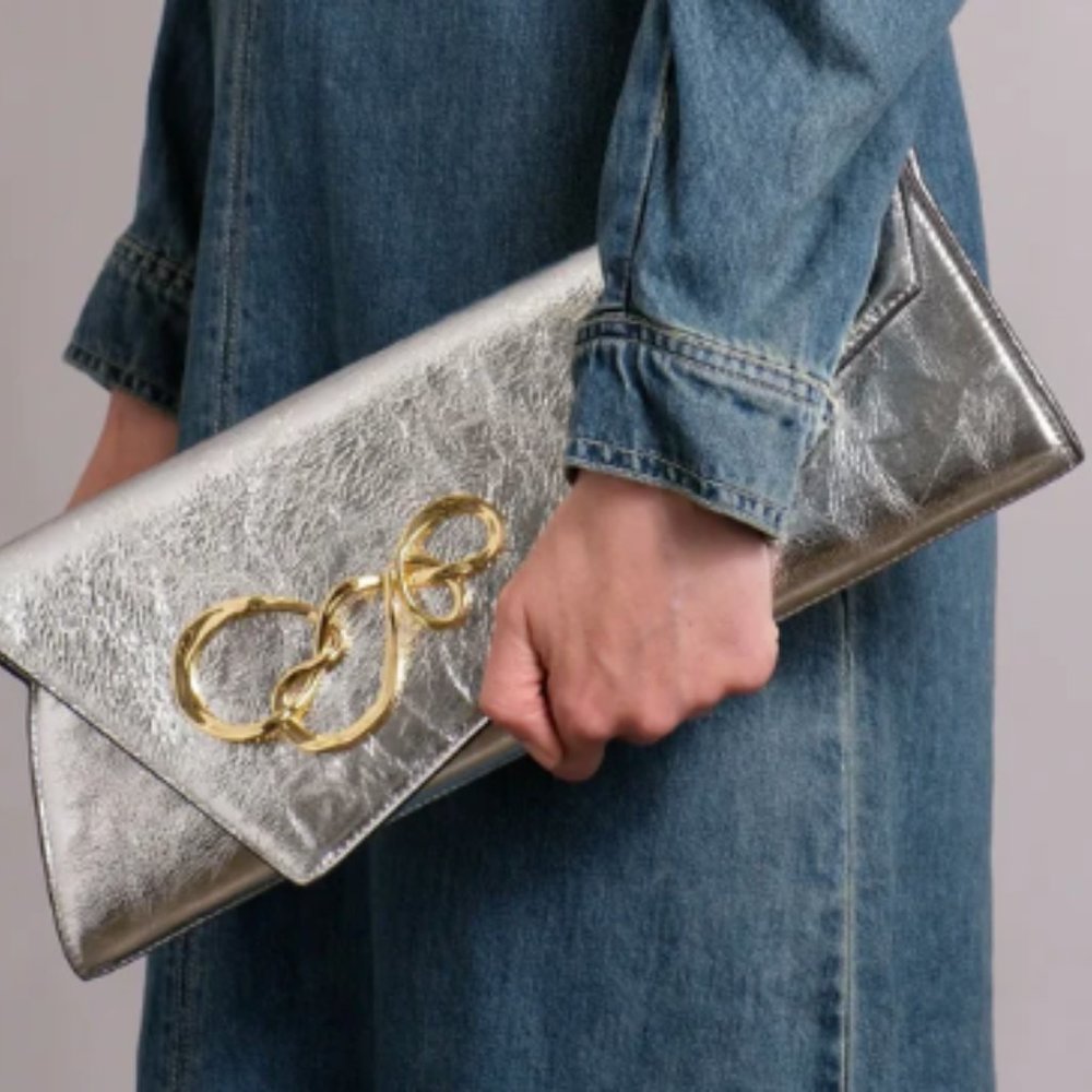 Large Twisted Angular Metallic Leather Clutch. NWT!